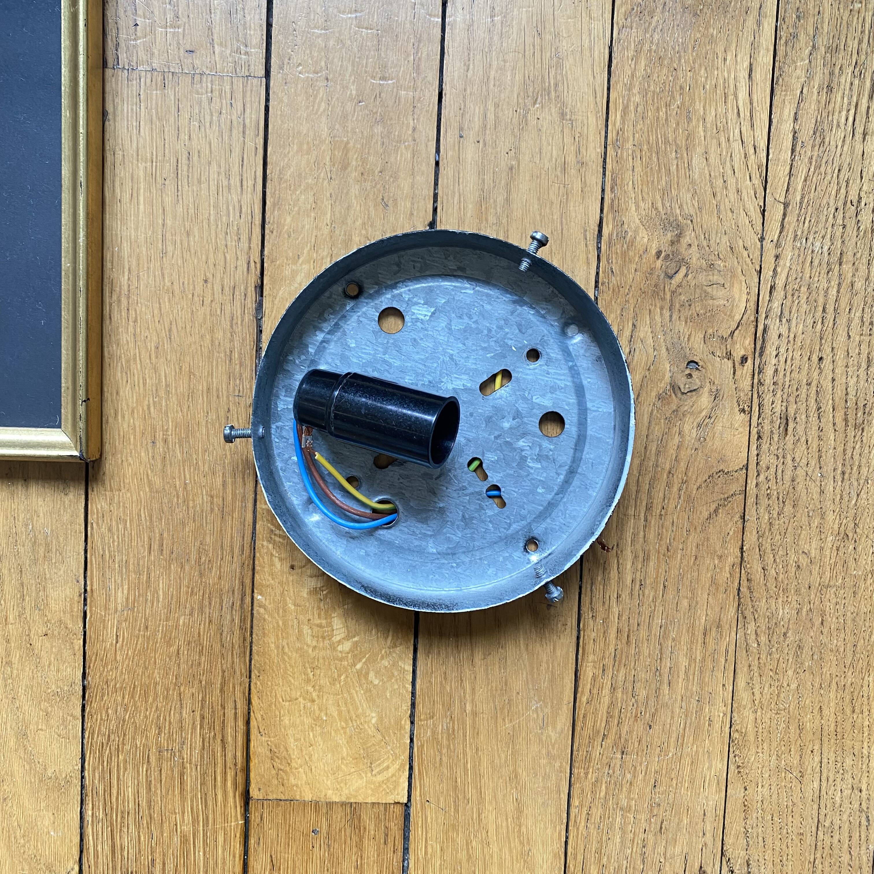 Wall lamp or ceiling light with minimalist porthole glass.