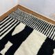 Black wool rug 250cm x 150cm