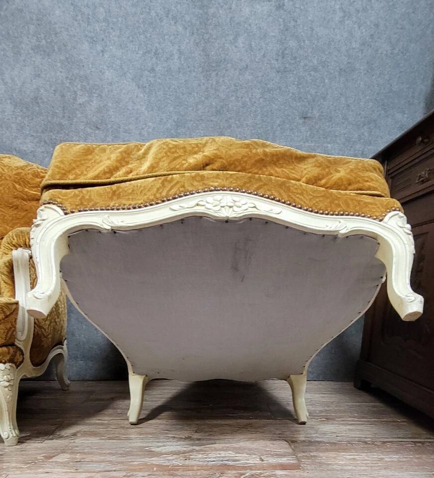 Pair of Louis XV style Bérgères in lacquered wood, 19th century