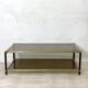 Vintage 1970s gold metal and smoked glass coffee table.