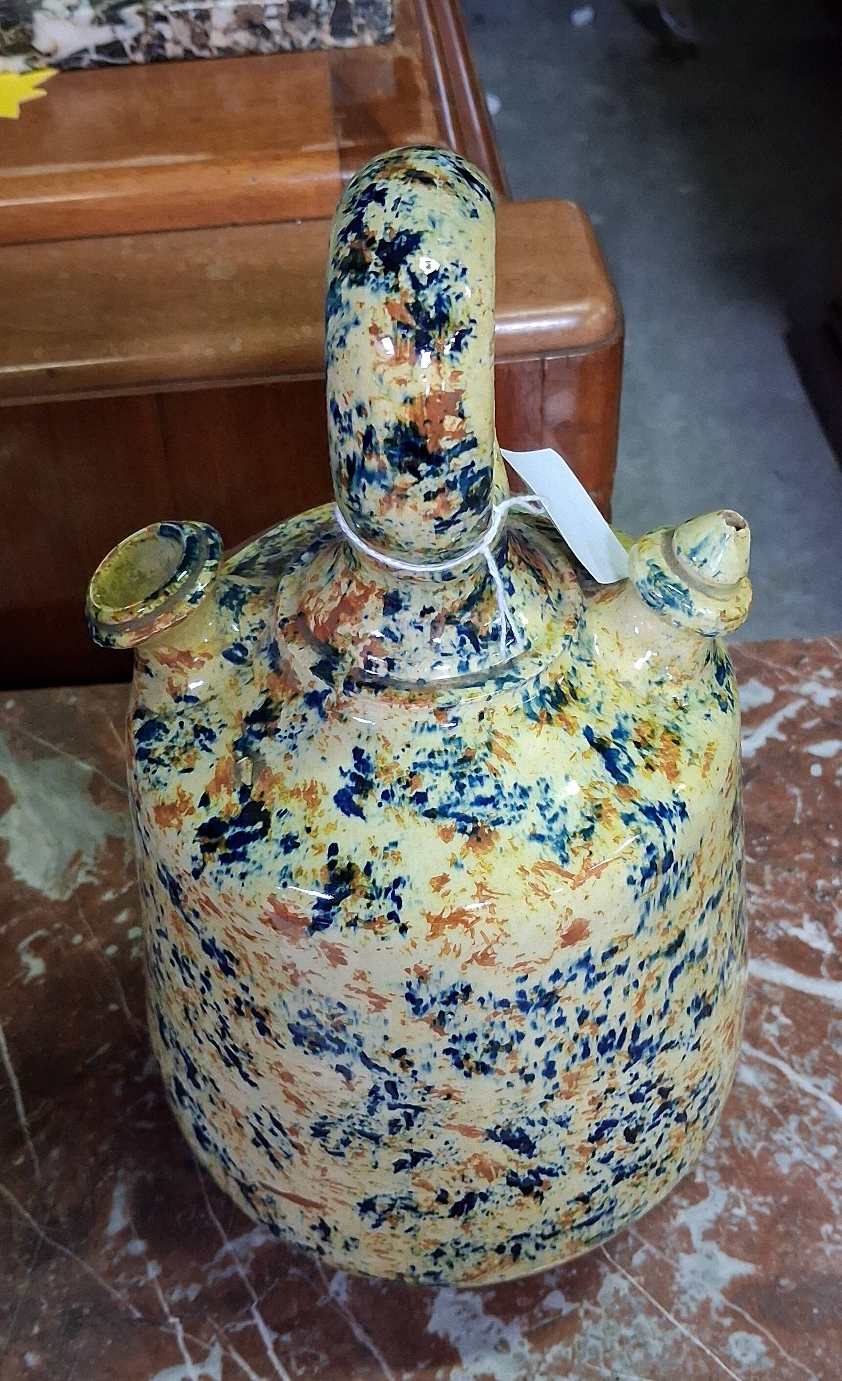 polychrome floral-decorated jug in glazed ceramic