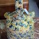 polychrome floral-decorated jug in glazed ceramic