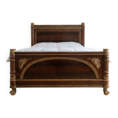 Brown wooden Napoleon bed: replica of the famous Emperor's bed.