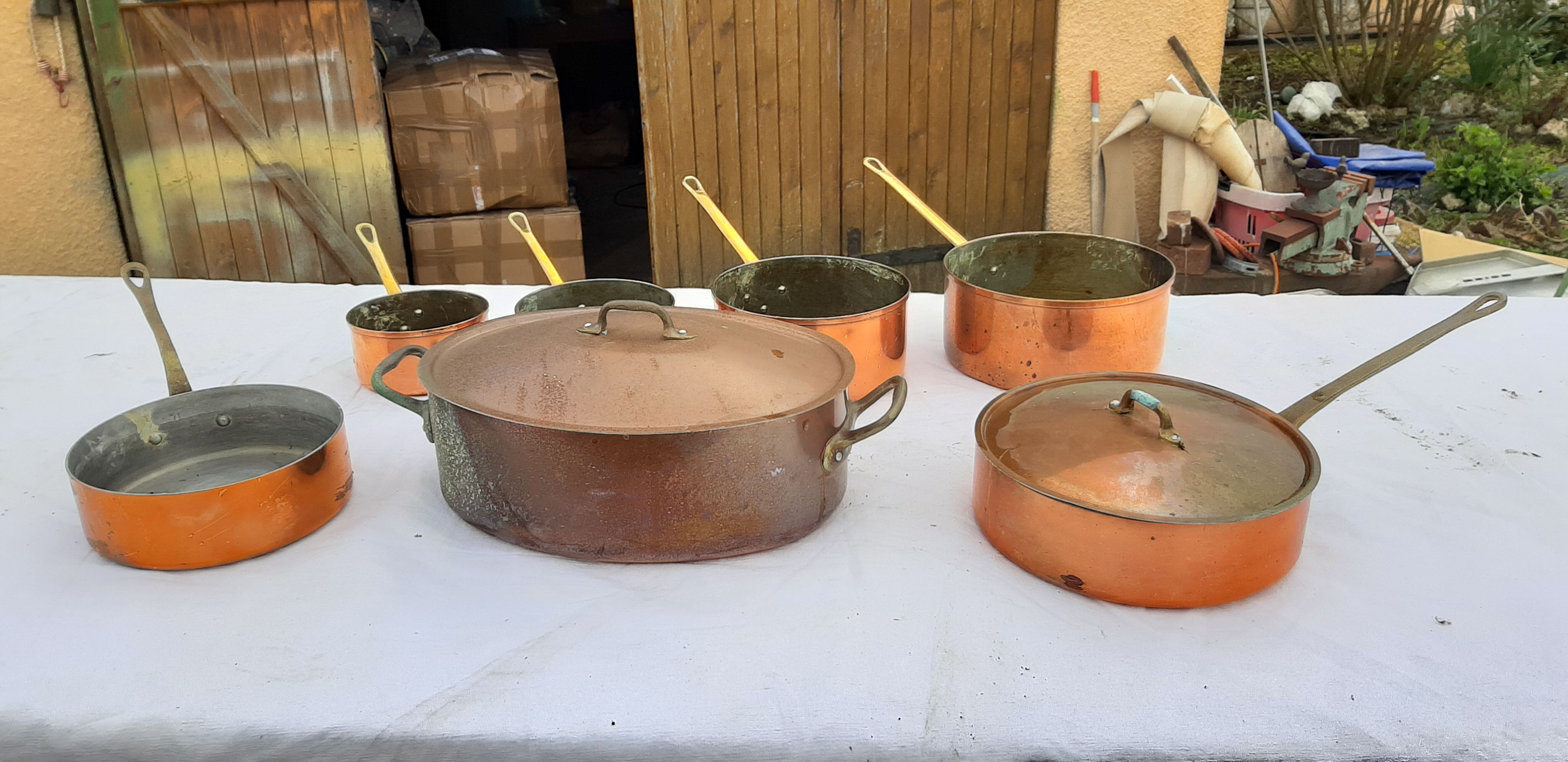 Lots of tinned copper kitchen utensils
