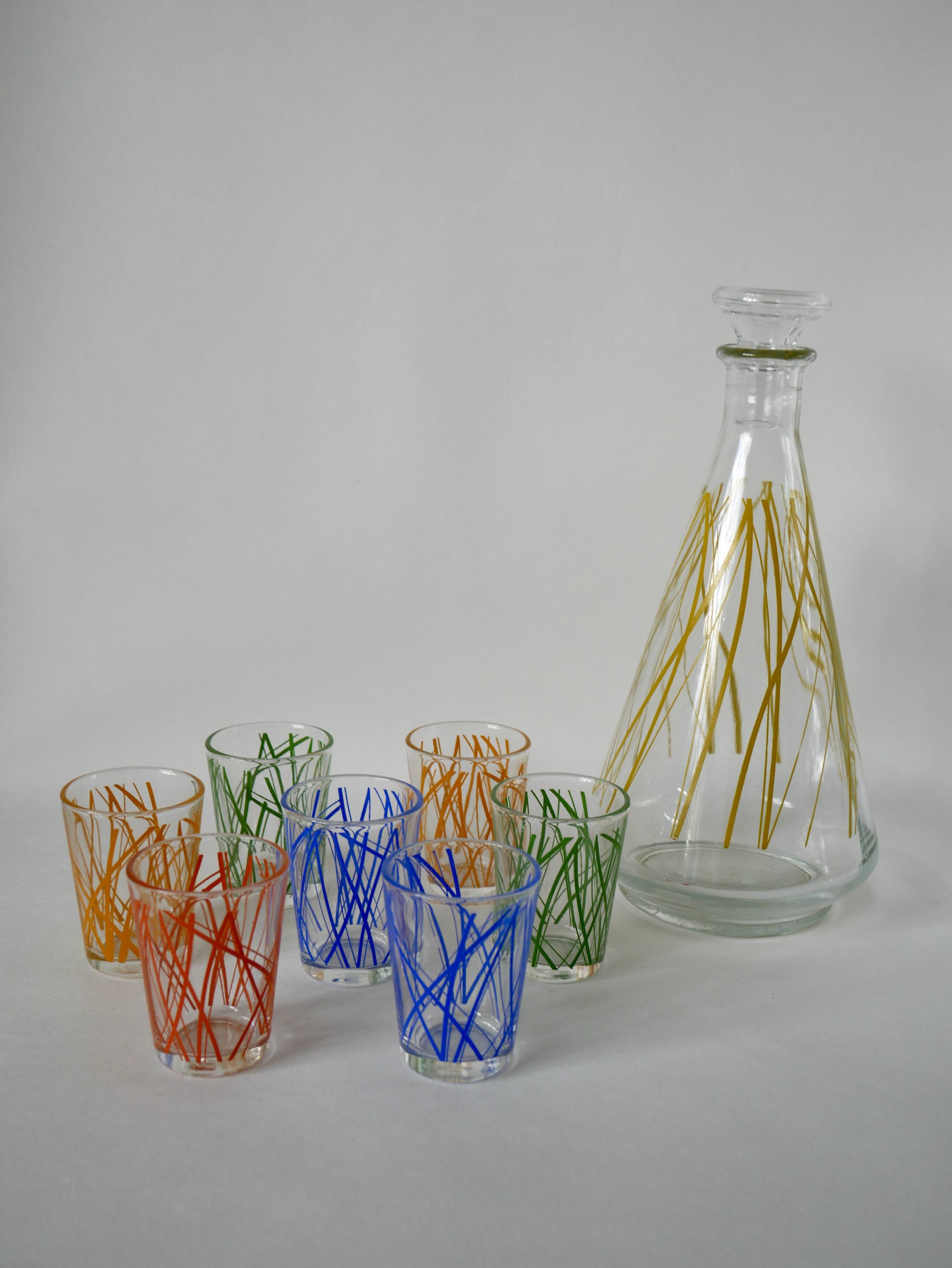 Colorful designer set composed of 7 liqueur glasses and a seventies 70s carafe