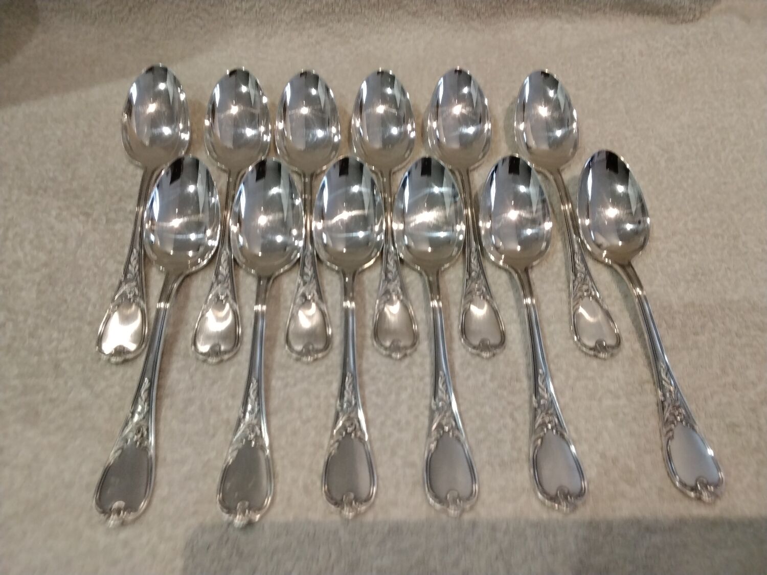 12 silver-plated metal soup spoons, Ercuis Dubarry model.