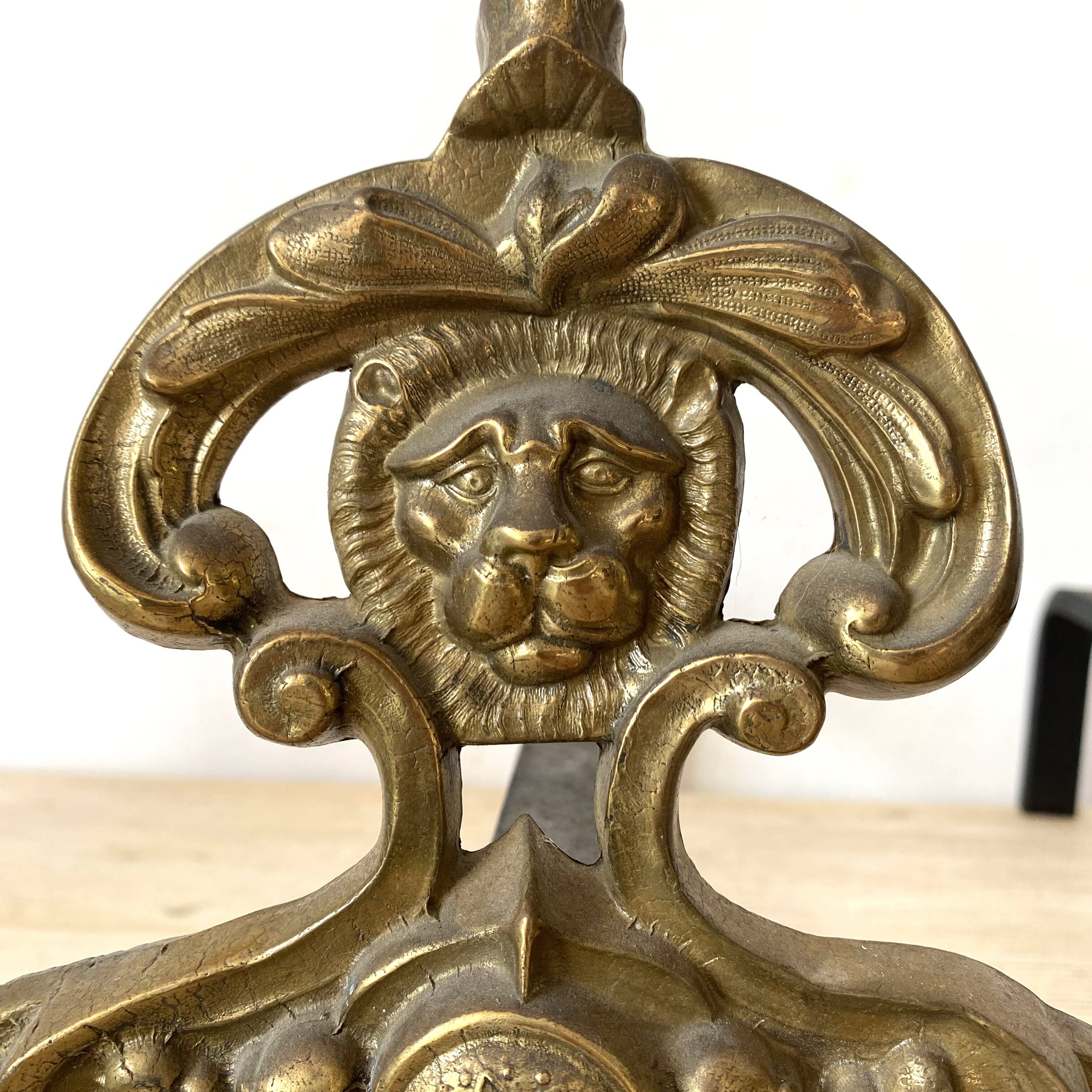 Pair of brass andirons, lion head