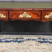 Louis XV style desk. Rosewood veneer, gilt bronze decoration, leather.