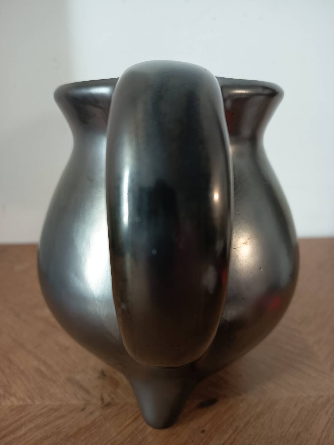 Black ceramic tripod jug