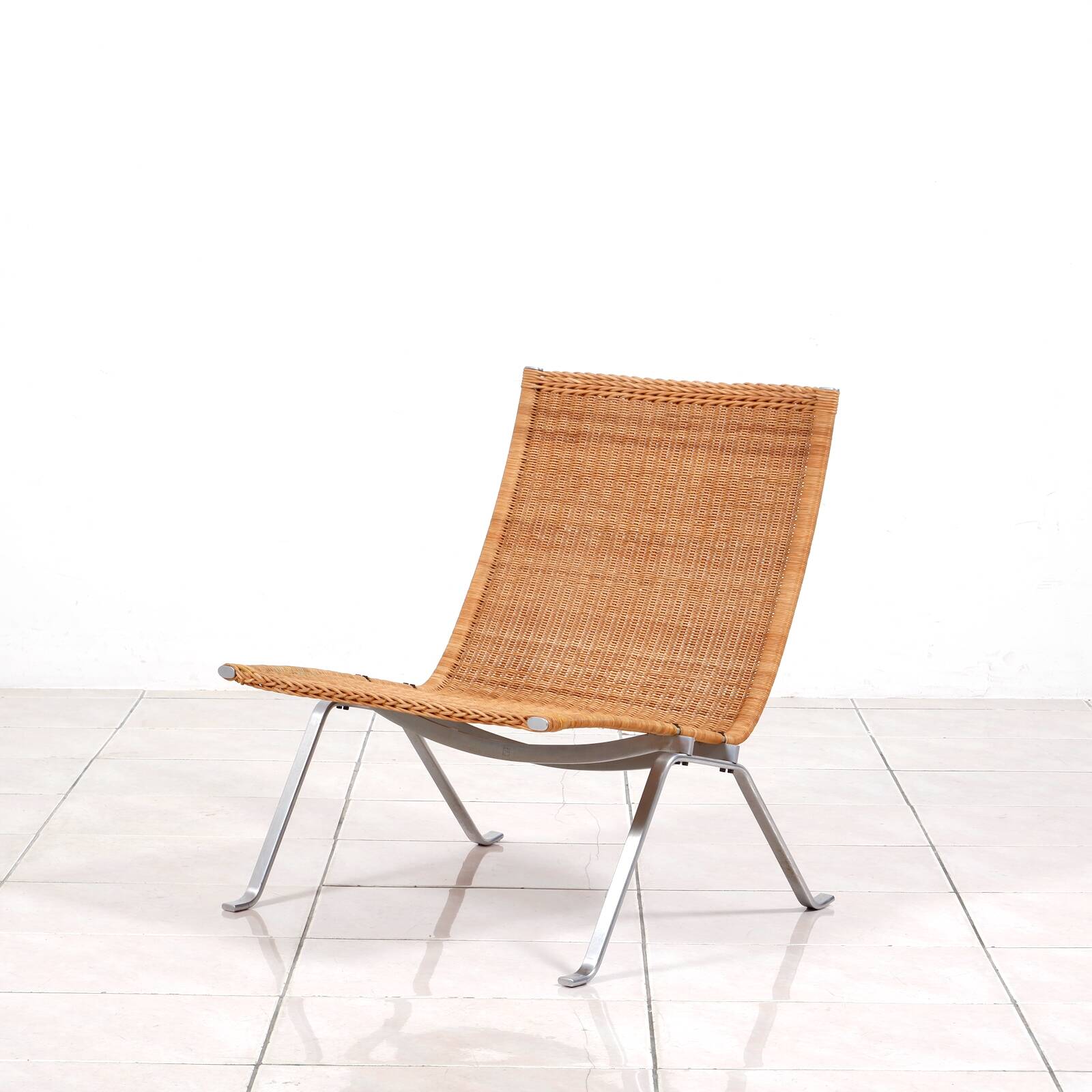 PK 22“ lounge chair in rattan by Poul Kjaerholm for E. Kold Christensen