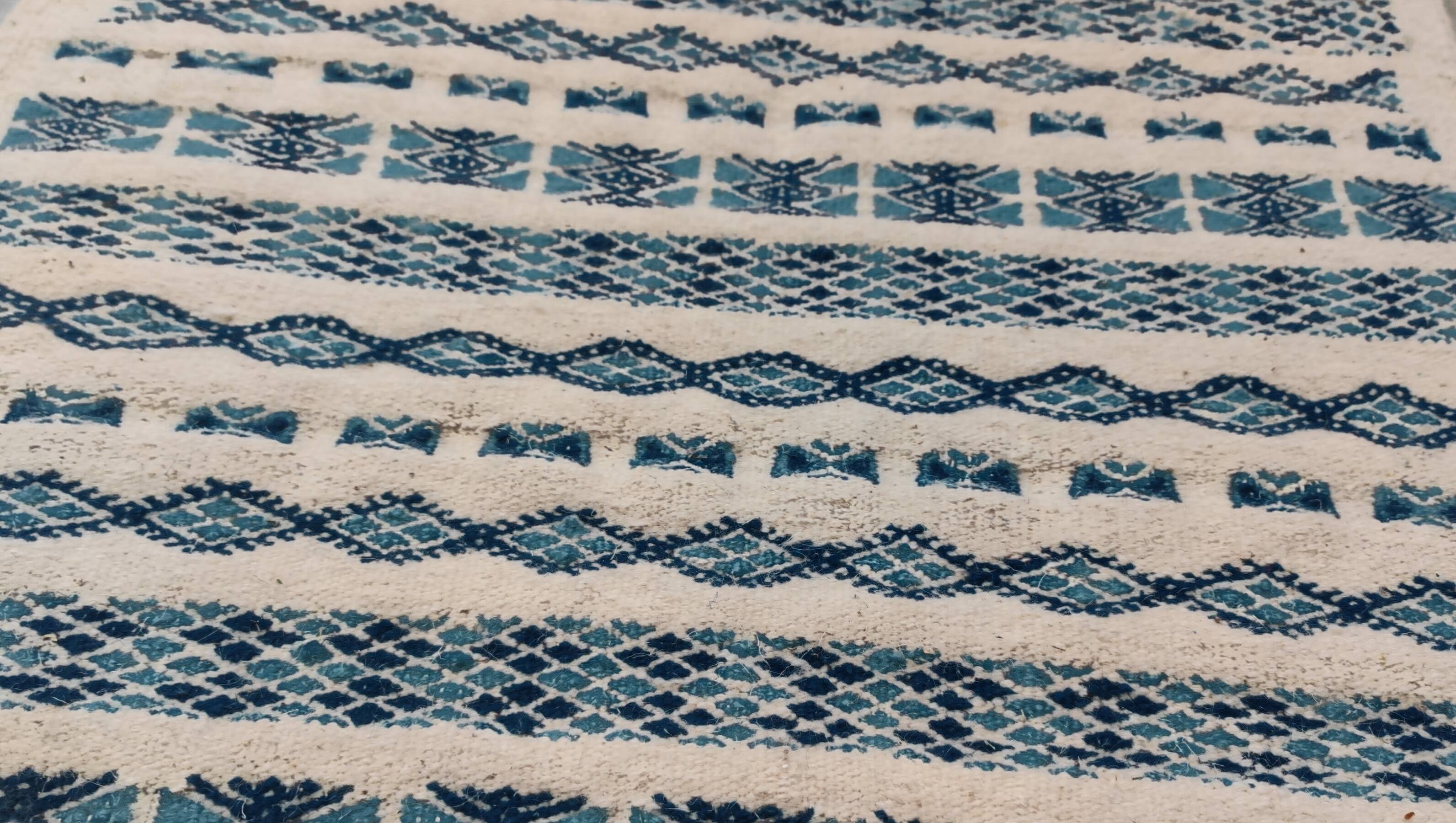 Traditional handmade white and blue carpet