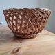 Braided wicker fruit basket