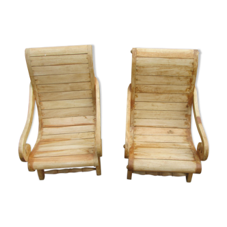 Deux fauteuils bas en teck