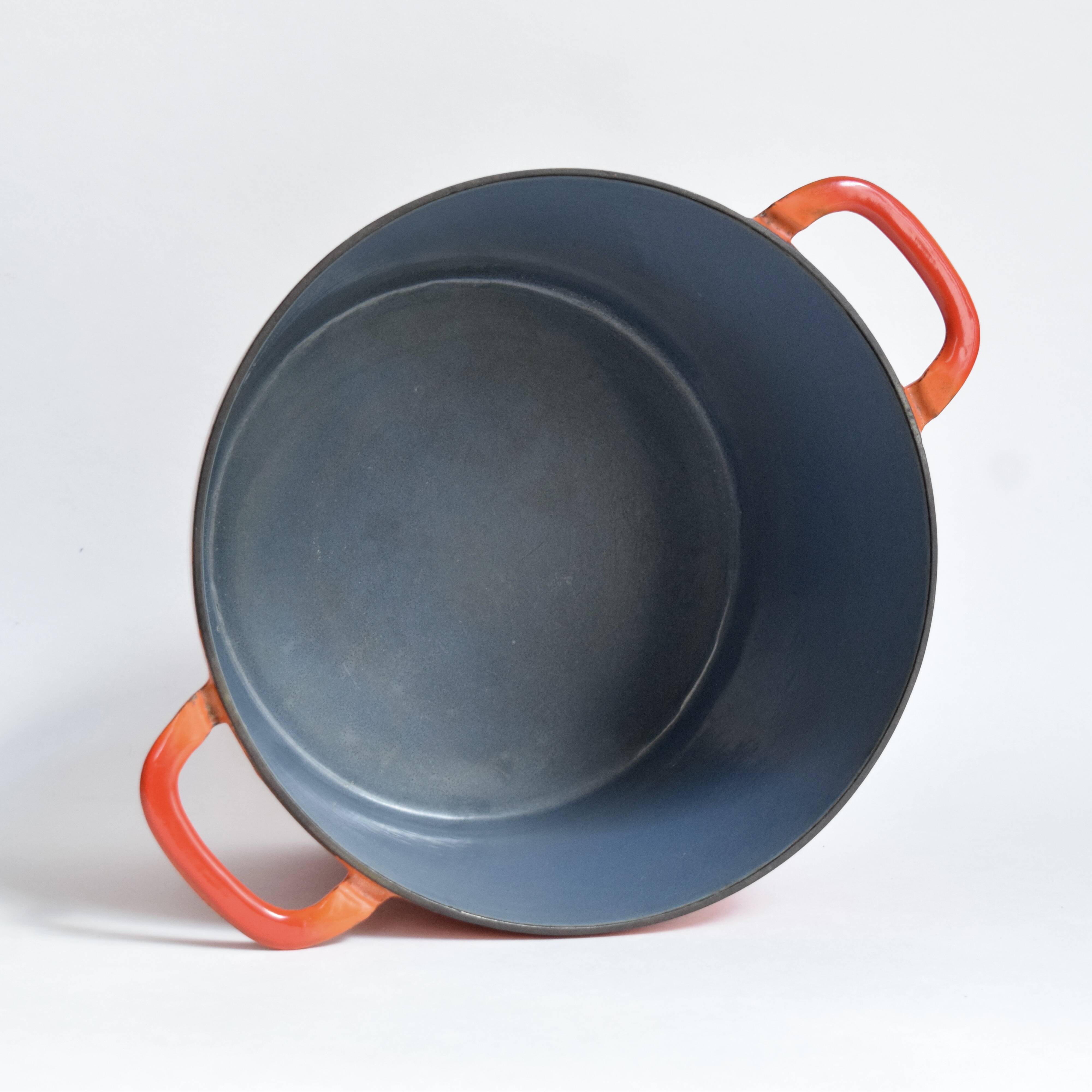 Large vintage saucepan or casserole dish in orange enameled cast iron