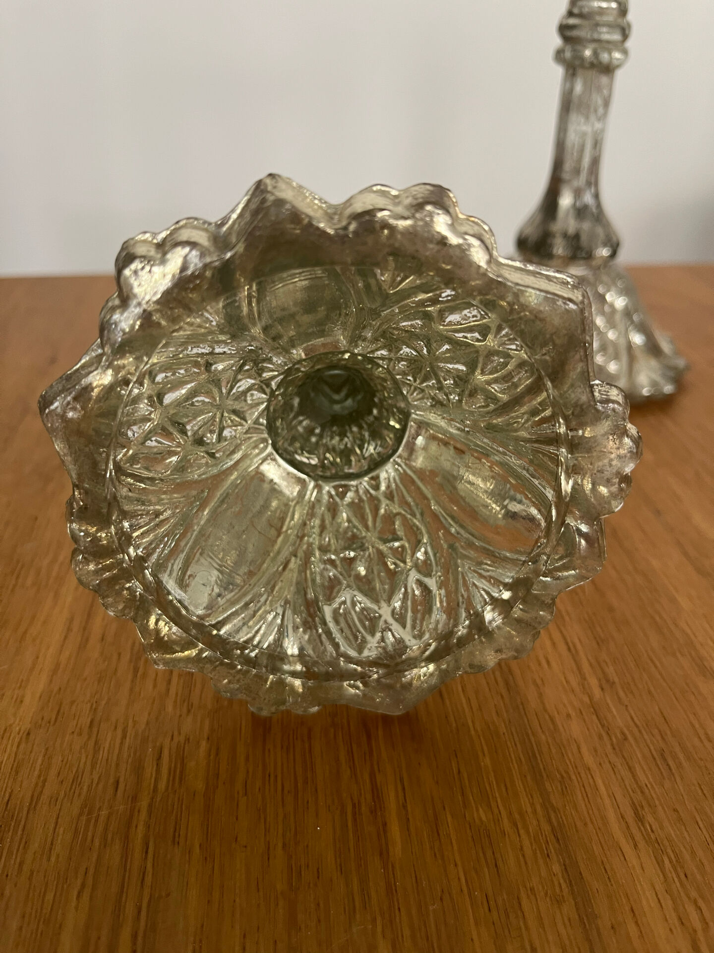 Pair of pressed glass candlesticks with silver plating.