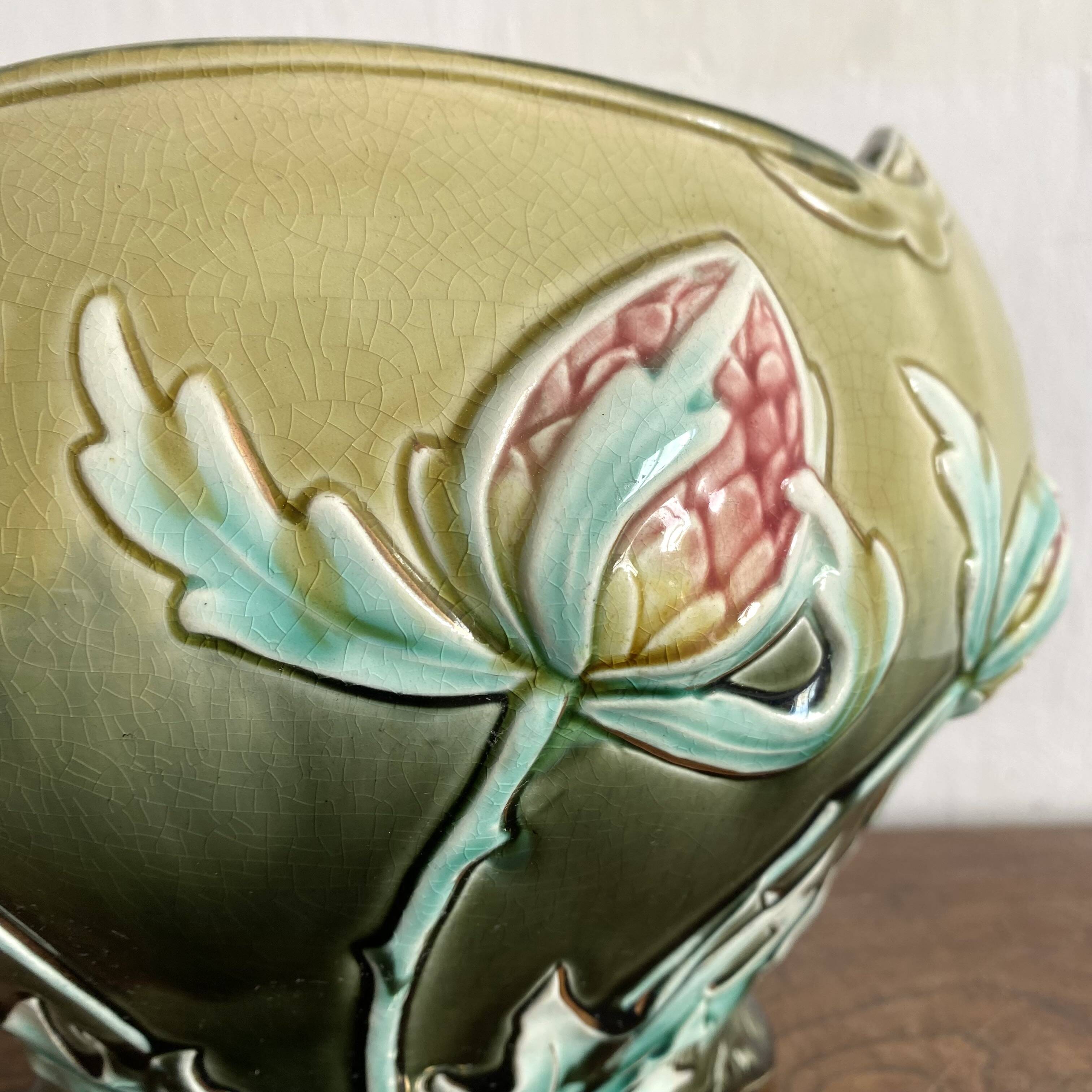 Large earthenware cache-pot in Art Nouveau style, decorated with thistles.