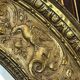 A. Arens, Antwerp, important oval mirror in repoussé brass with numerous animal decorations