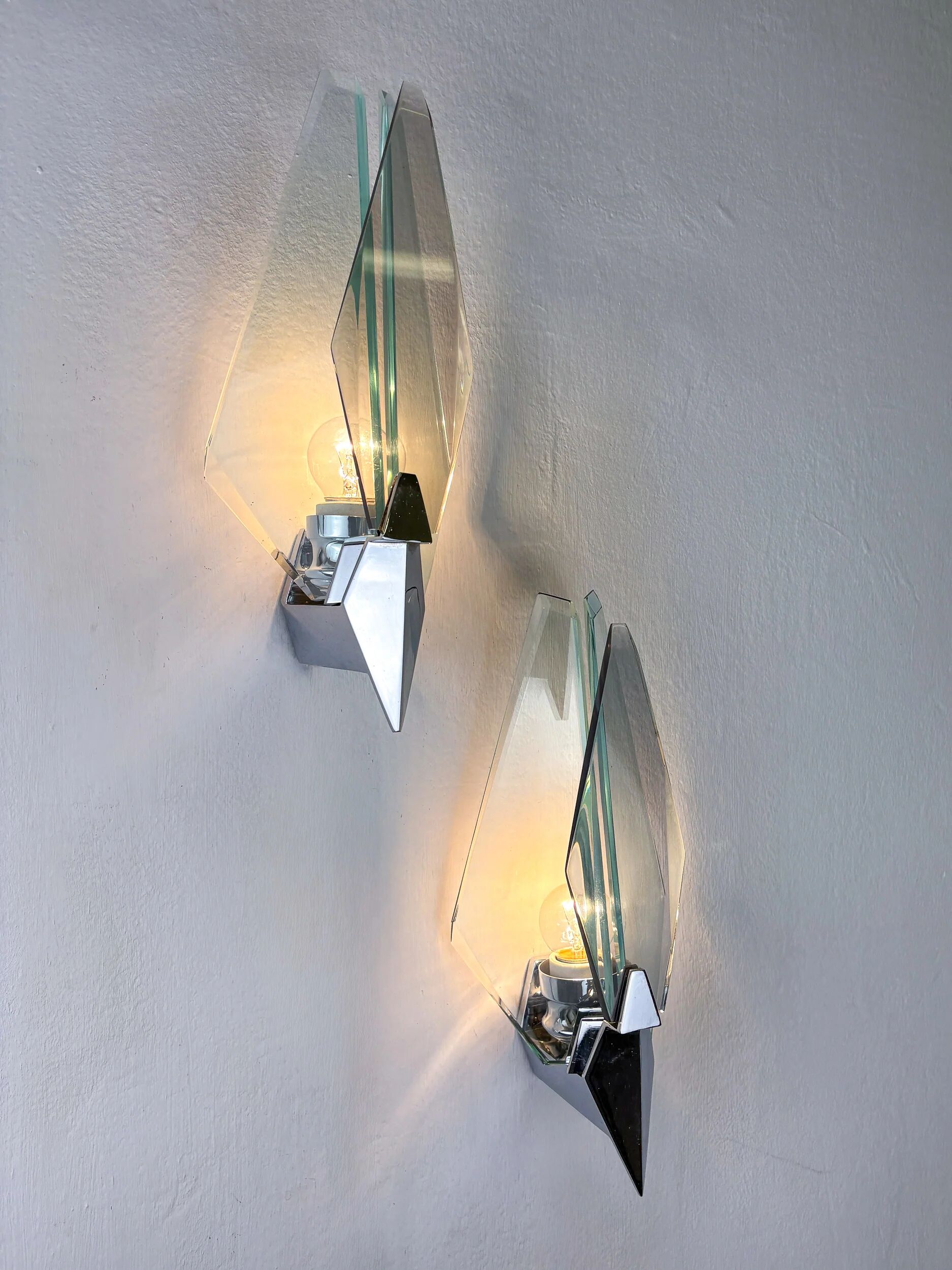 Pair of Veca sconces, Murano blue cut glass & black lucite, Italy, circa 1970s