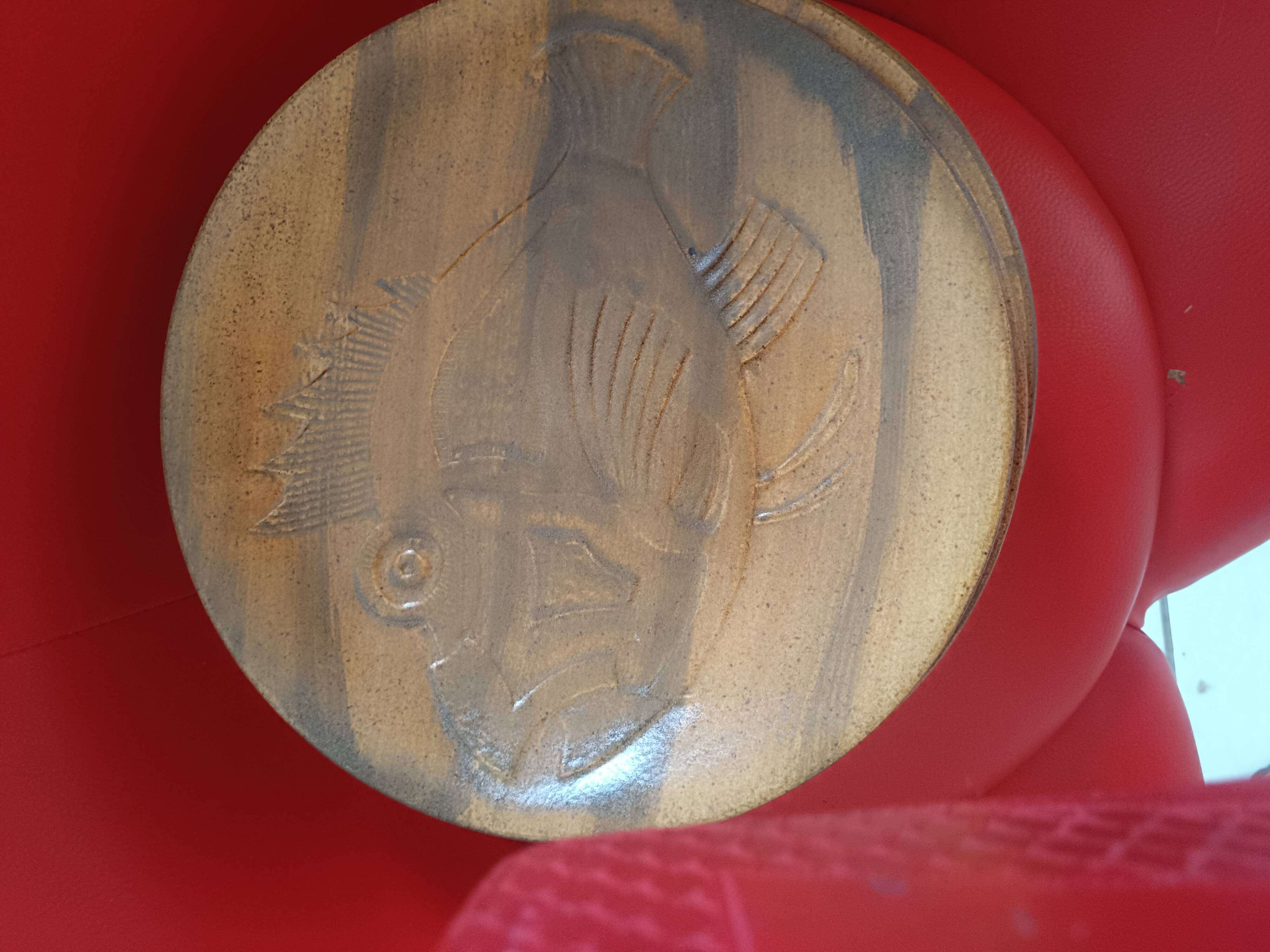 12 stoneware dinner plates in shades of beige and brown. Chantilly, France. Fish motif.