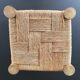 Wooden stool seated in braided rope