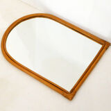 Rounded wall mirror in rattan 35x45cm