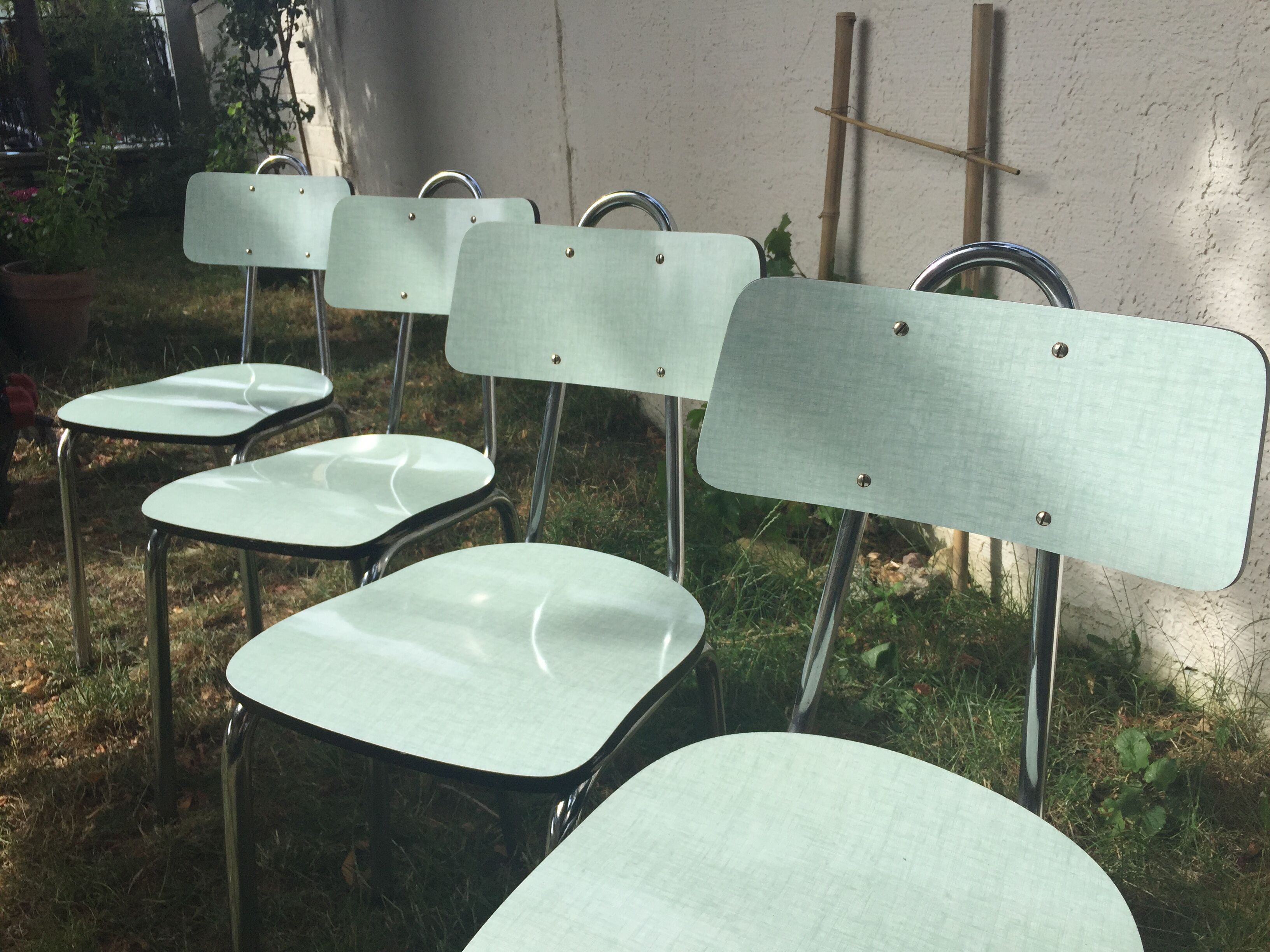 Table and 4 green water formica chairs 60's