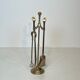 Neoclassical brass fire accessory.