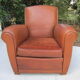 Paire de fauteuils club en cuir