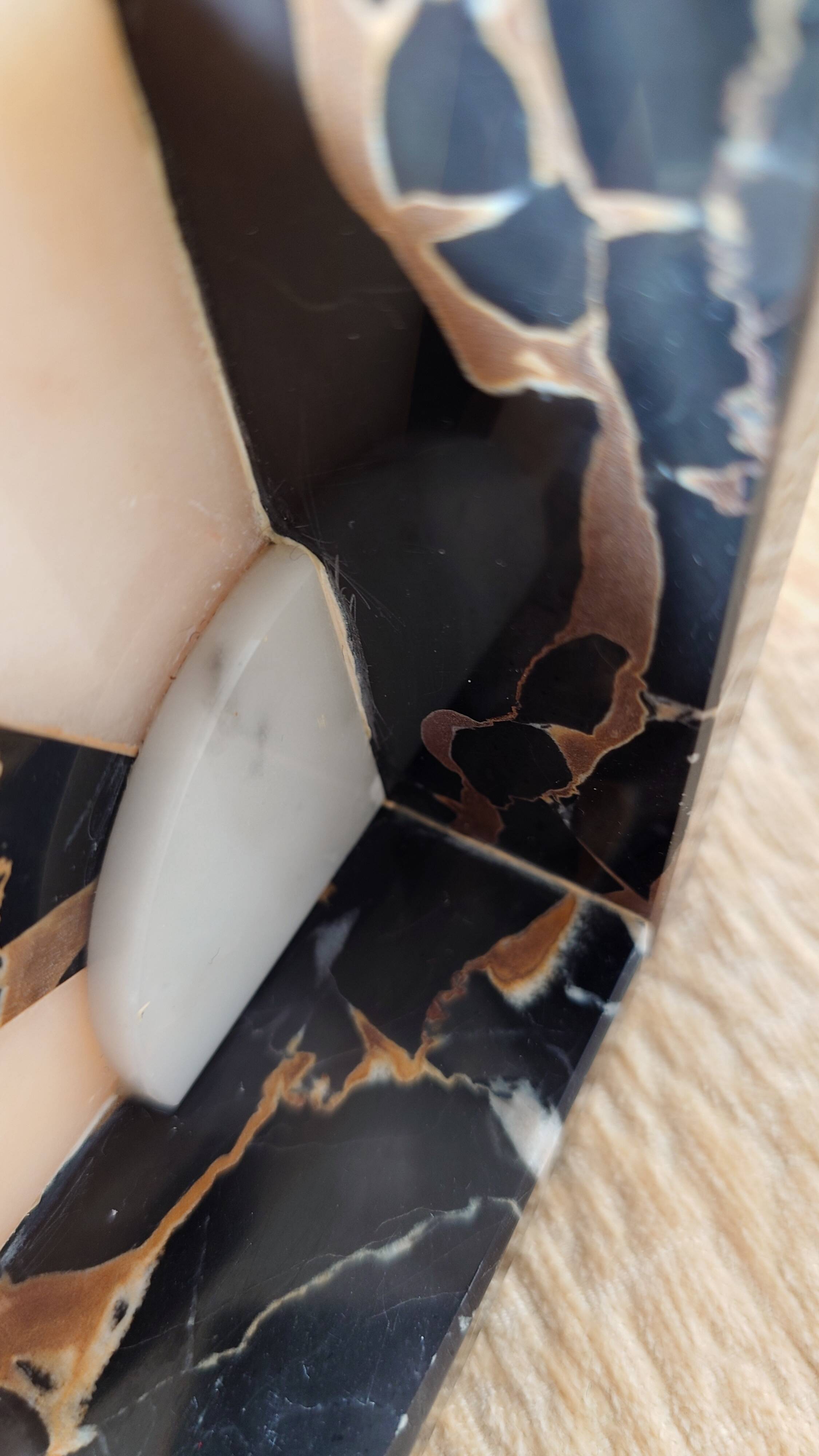 Art Deco pair of bookends in Portor marble and onyx, 1930s-1950s.