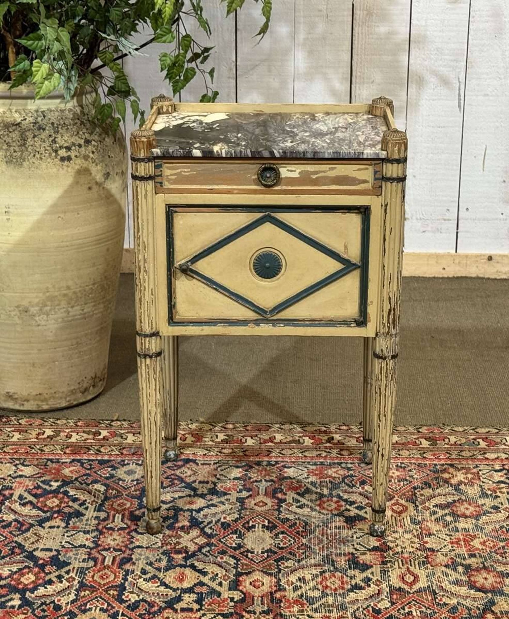 Beech bedside table painted with a marble top in Louis XVI style from the late 19th century.