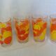 Verres vintage décorated with orange and yellow lemon fruits, Italy.