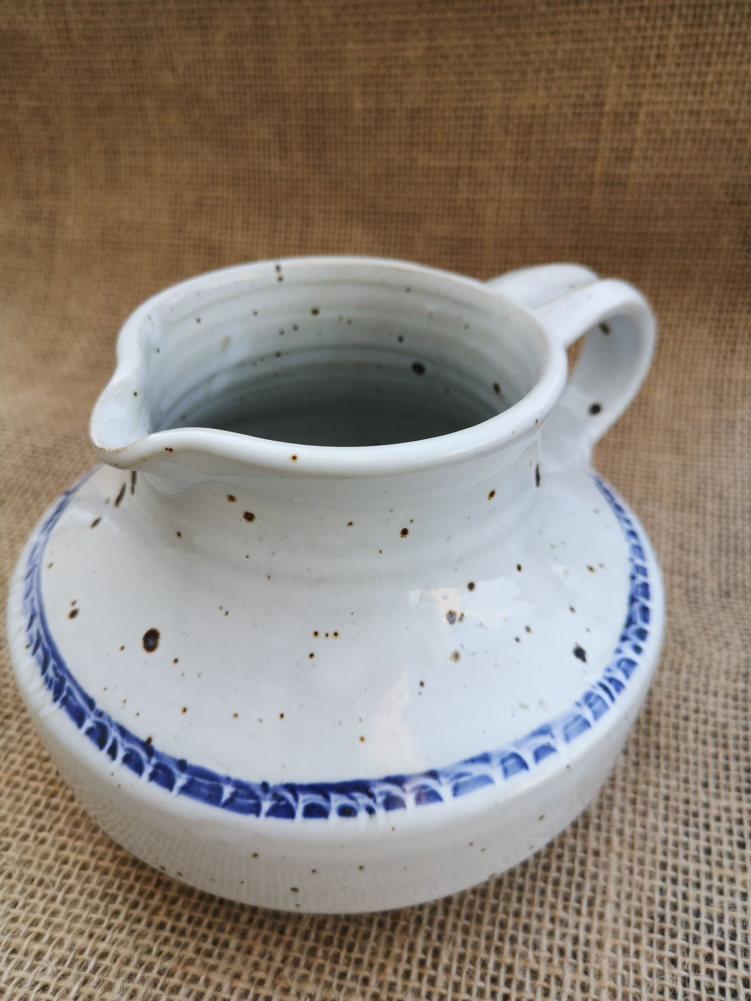 Pitcher in speckled sandstone
