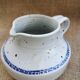 Pitcher in speckled sandstone