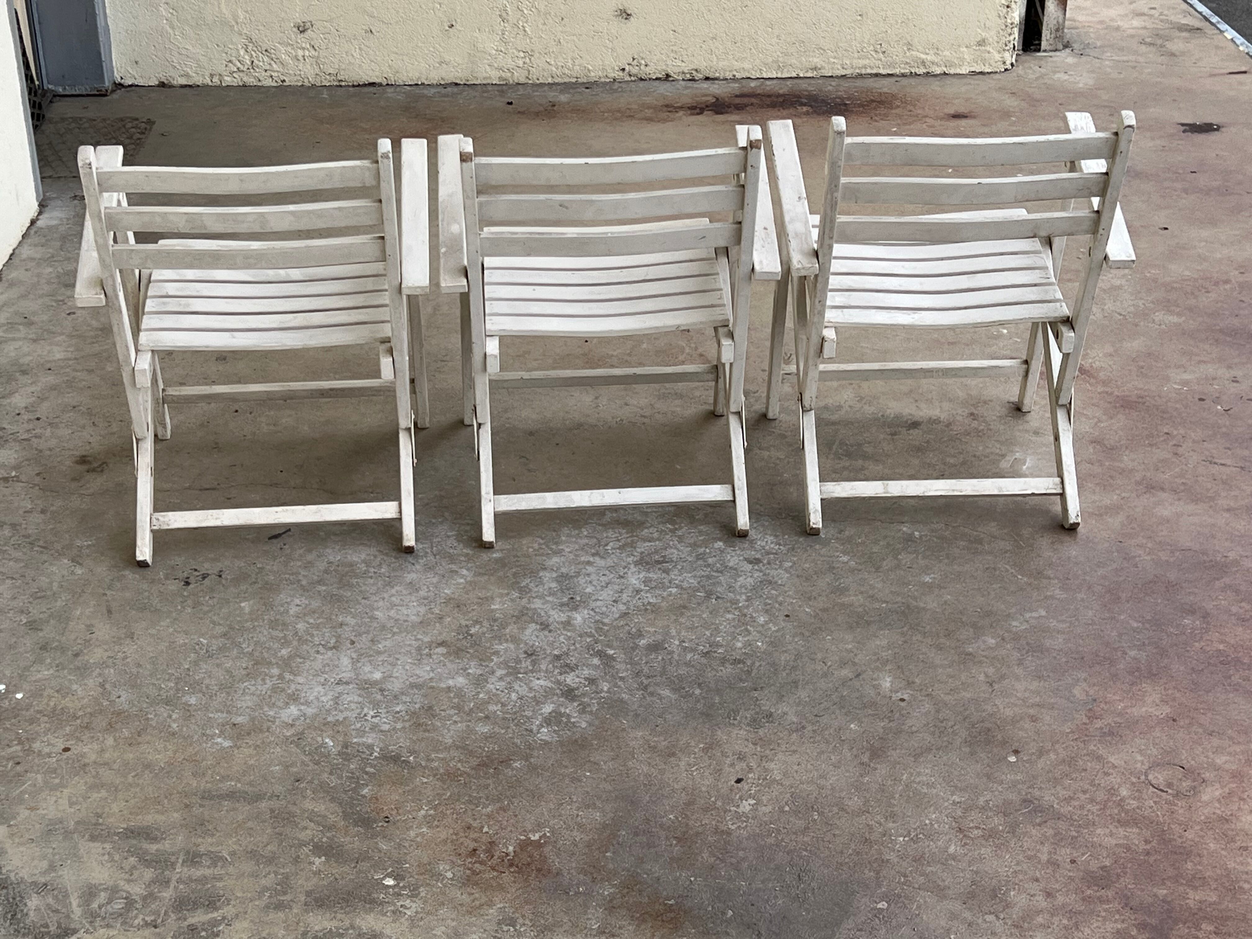 Folding wooden armchairs