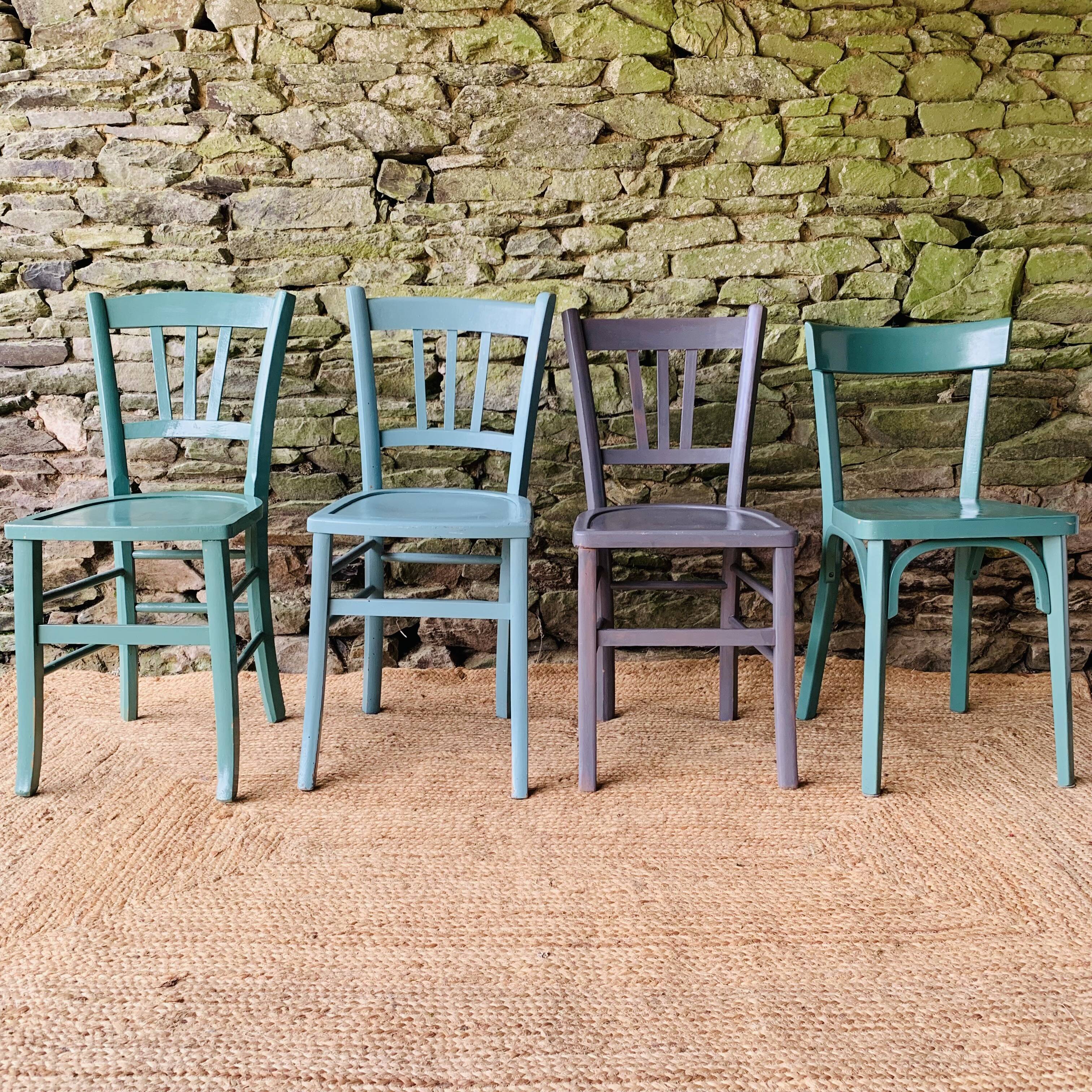 Set of four mismatched bistro chairs