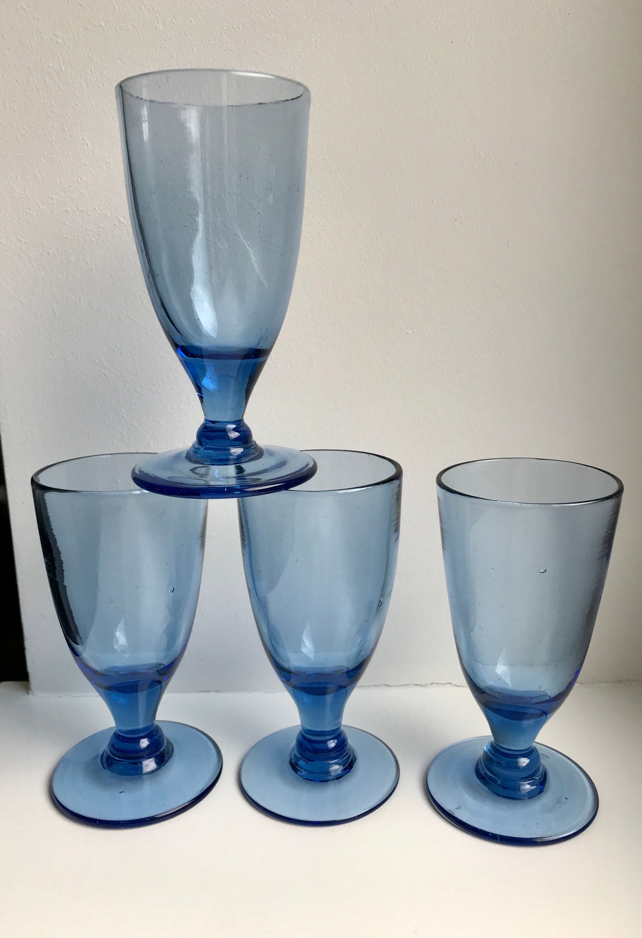 Set of 4 20s blue molded glass foot glasses
