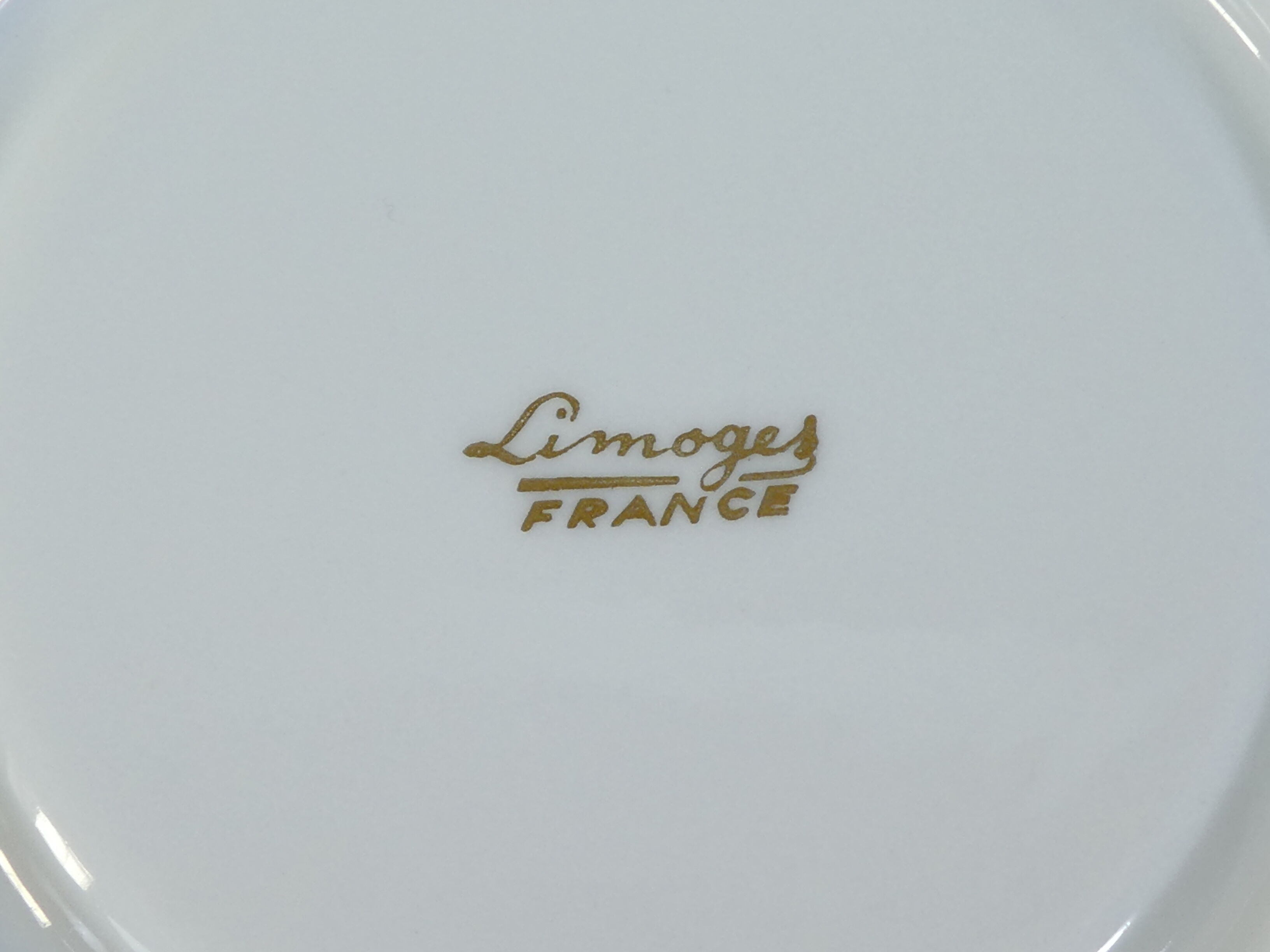 Green and gilded LIMOGES porcelain cup and cup lunch