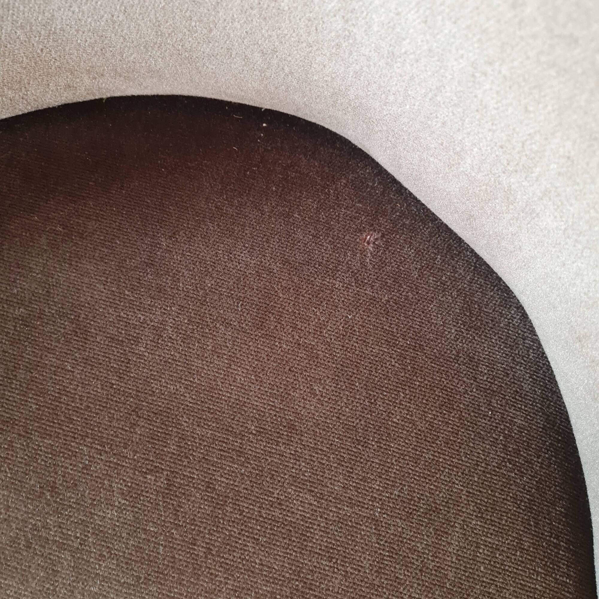 Brown velvet crapaud armchair with fringes and sculpted legs.