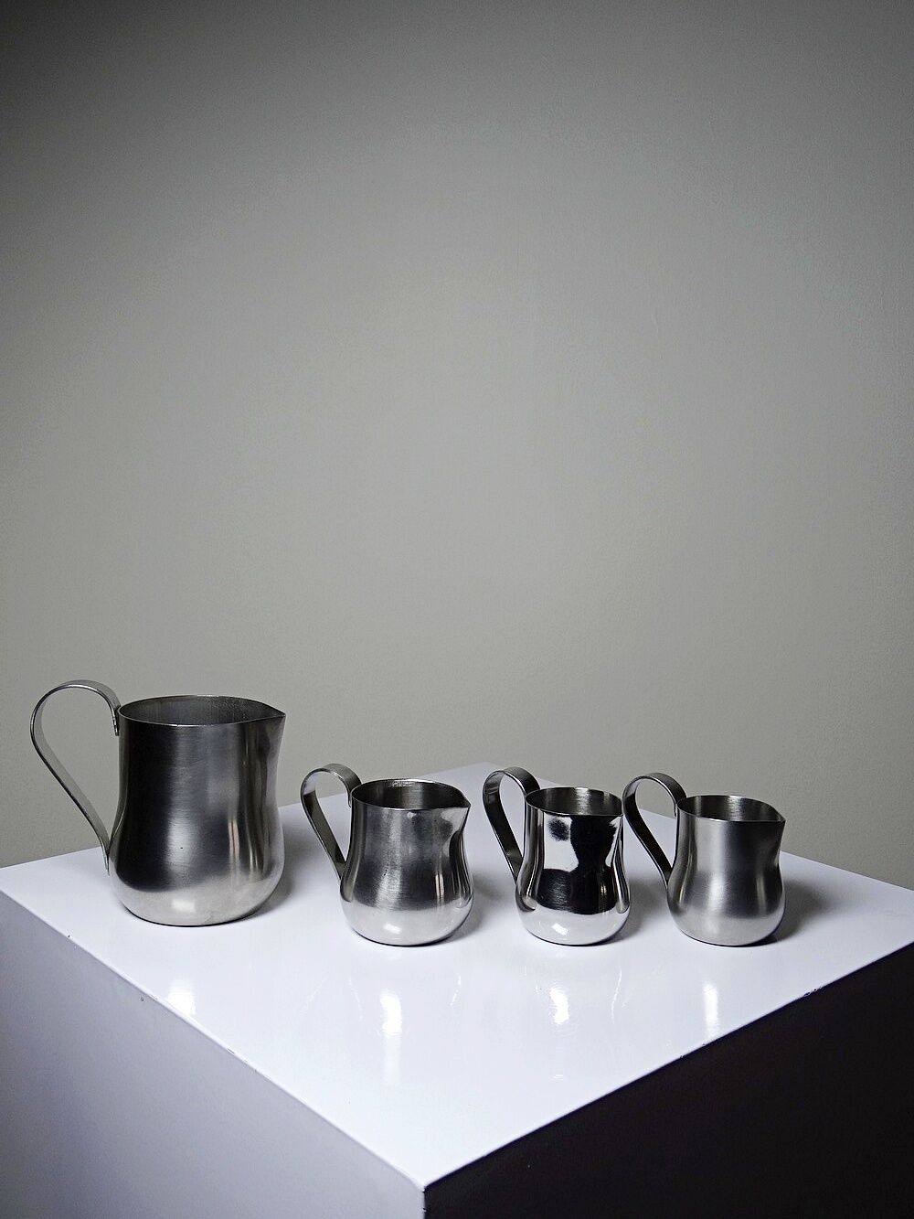 Set of 4 vintage bar measures in brushed stainless steel from the 60s-70s.