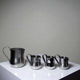 Set of 4 vintage bar measures in brushed stainless steel from the 60s-70s.