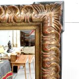 Gold-tinted wooden and stucco rectangular mirror - 1920