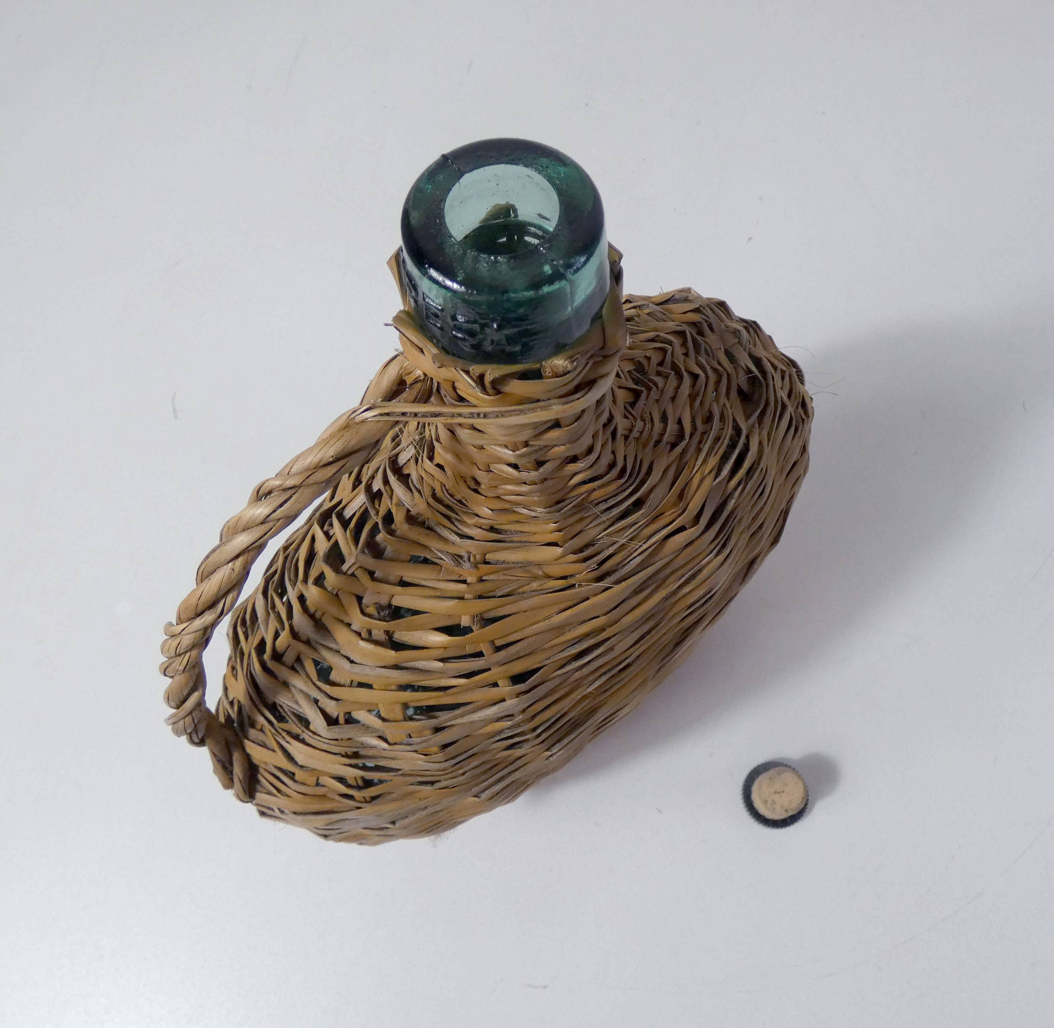 old bottle dressed in rattan vintage pilgrim gourd