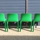 Set of 4 green Selene Magistretti chairs.