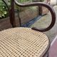 Antique Thonet bench in bent wood and caning, signed.