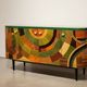 A beech wood Art Deco sideboard with polychrome marquetry.