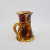 Beautiful ceramic pitcher in fire colors