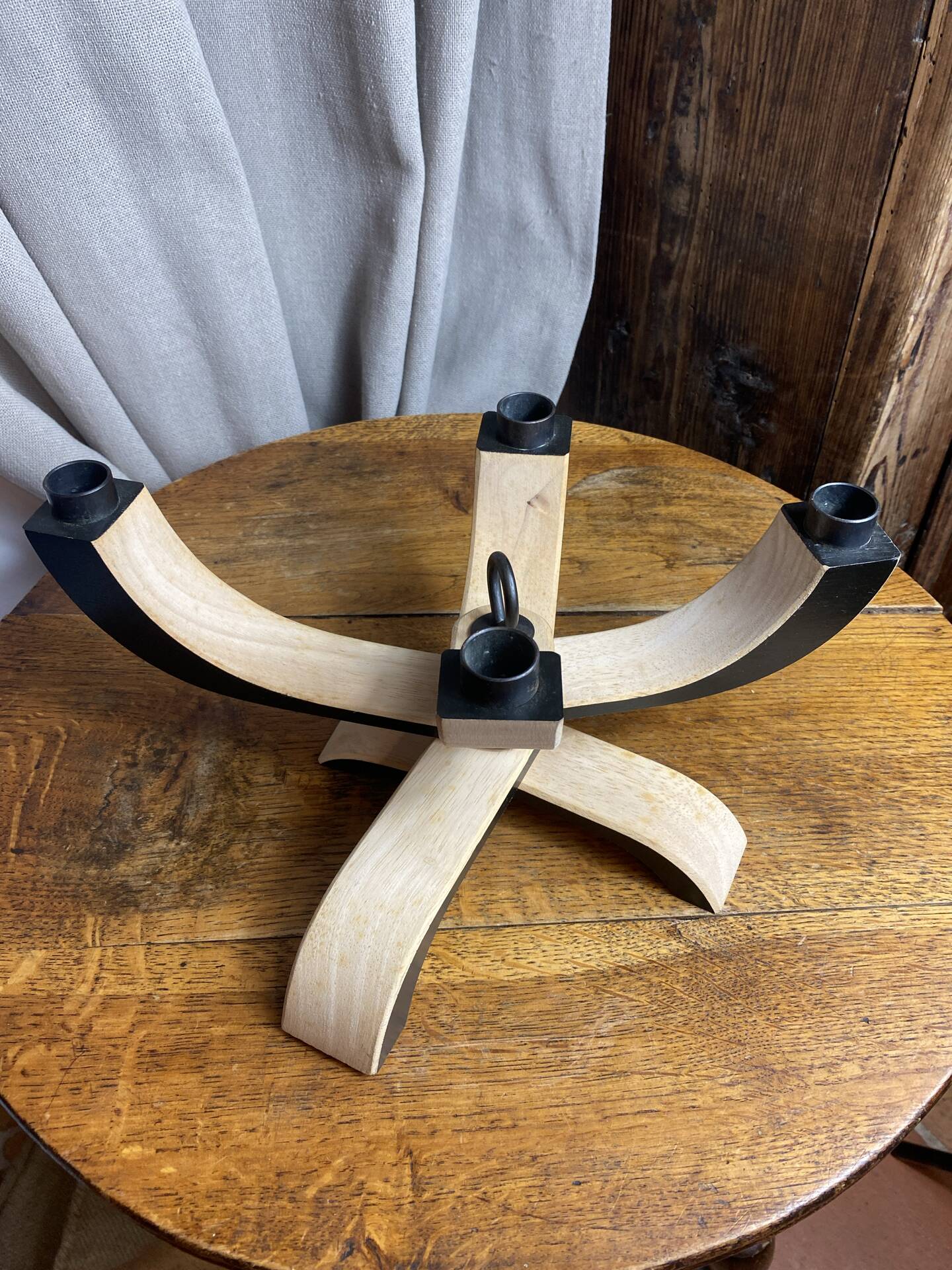 Foldable and deconstructed chandelier, minimalist Swedish design in wood.