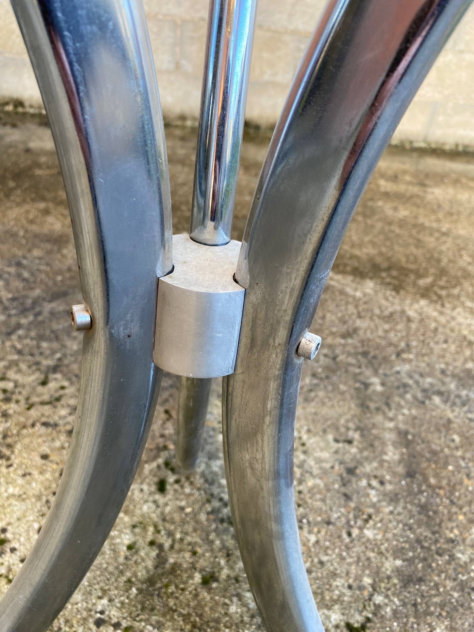Table with chrome metal legs and smoked glass top.
