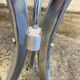 Table with chrome metal legs and smoked glass top.