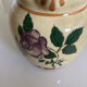 Old ceramic jug with floral decoration